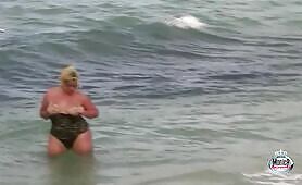 Monica Richard flashing at the beach